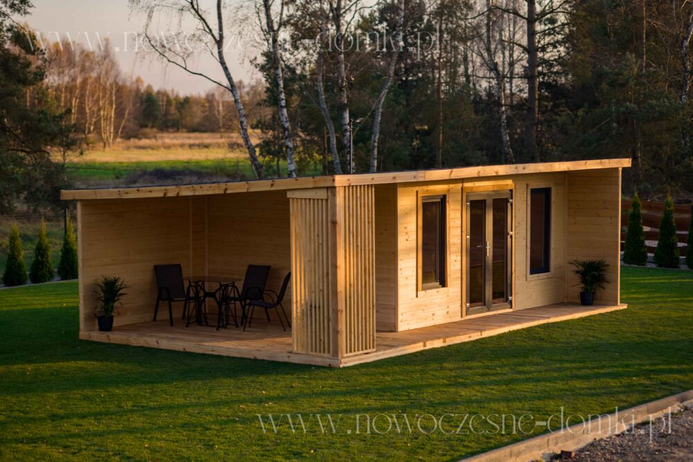 Picturesque wooden garden house with a spacious terrace.