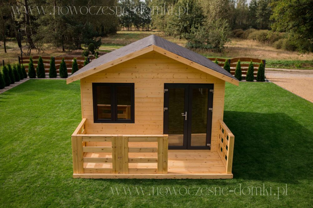 Wooden gazebo with a terrace and windows for use as an office - perfect place for a peaceful summer workspace.