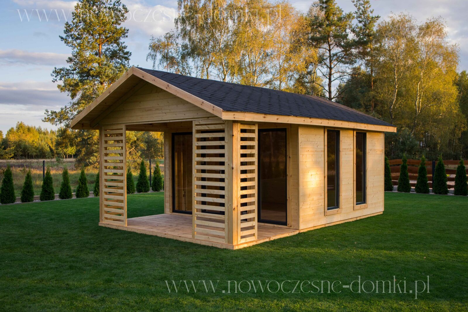 Wooden summer house with a spacious terrace - perfect place for a summer getaway.